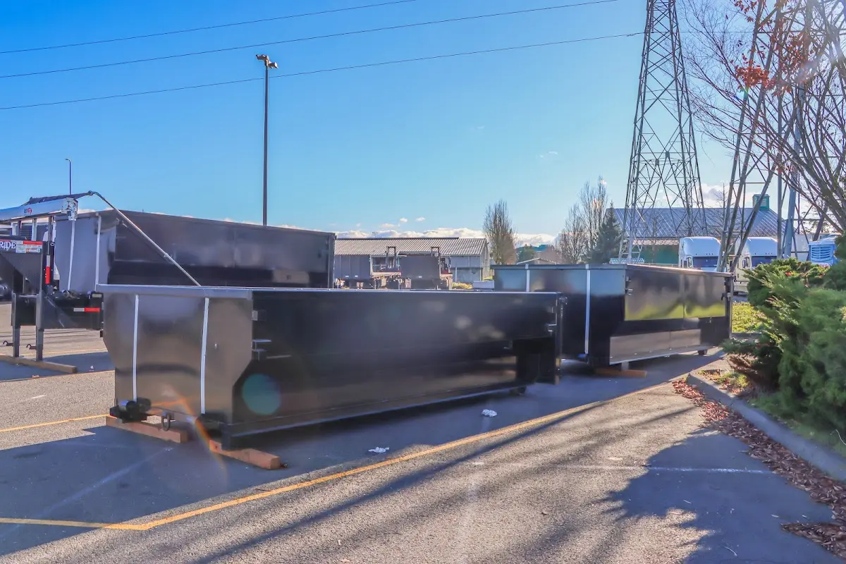 Roll-off dumpster ready for waste disposal at job site for Demolition Dumpster Rental in Gladstone